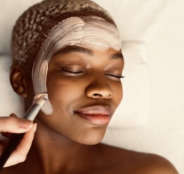 Signature facial treatment mask being applied with a brush
